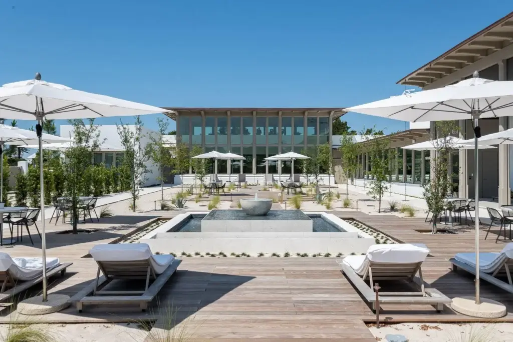 Zuma Wellness Center courtyard with fountain and lounge seating at Alys Beach FL