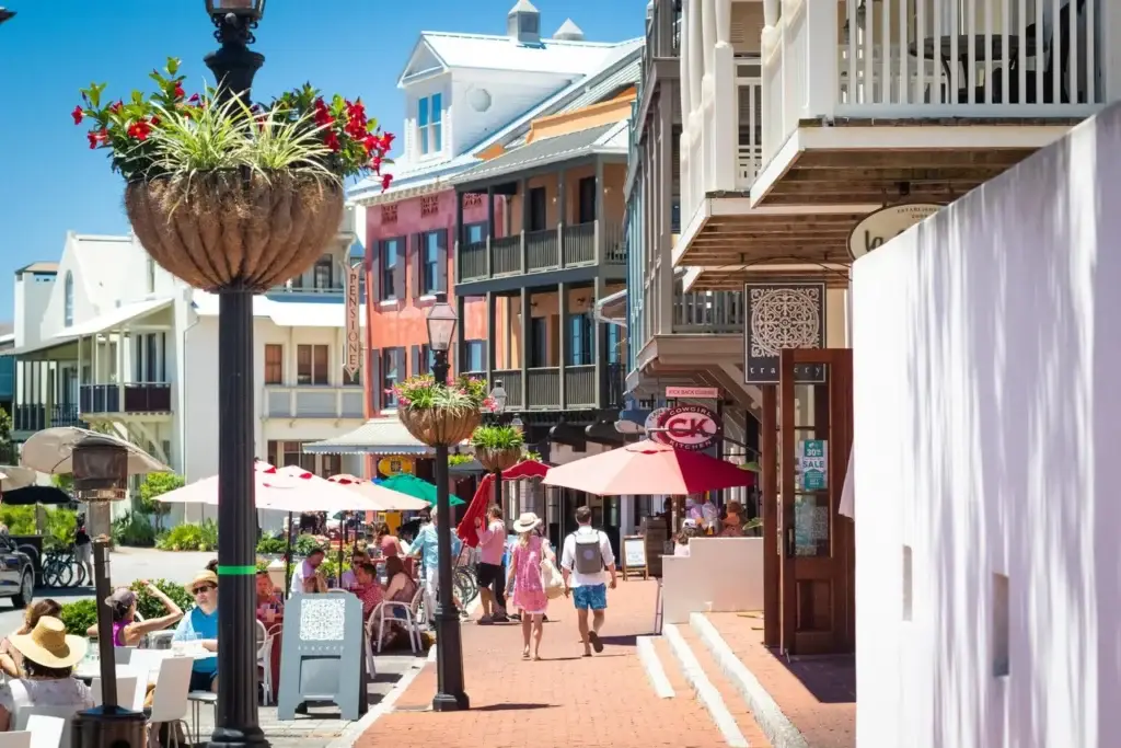 Rosemary Beach Main Street with outdoor dining and pedestrian activity during high season