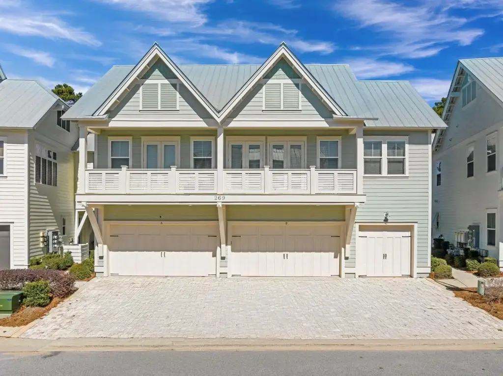 Triplex townhome units at Prominence on 30A Florida with two-story attached construction and garages
